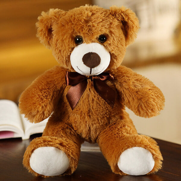 ours en peluche avec nœud brun fonce
