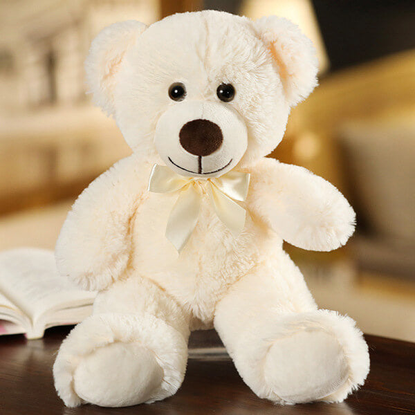 ours en peluche avec nœud beige