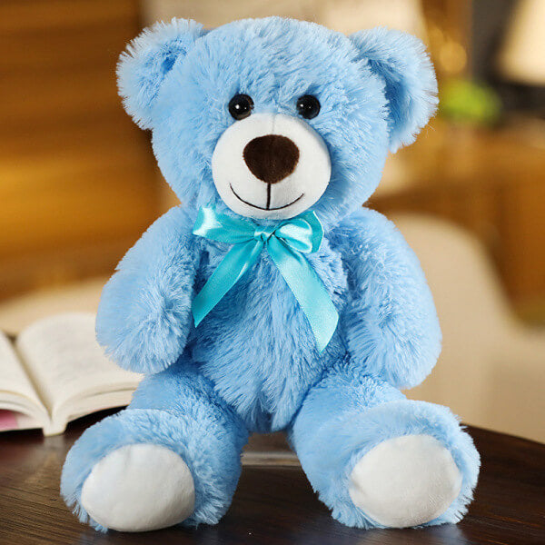 ours en peluche avec nœud bleu