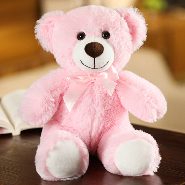 ours en peluche avec nœud rose