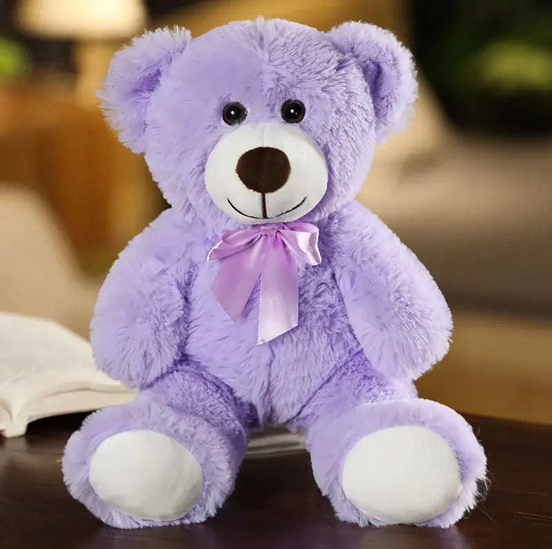 ours en peluche avec nœud violet