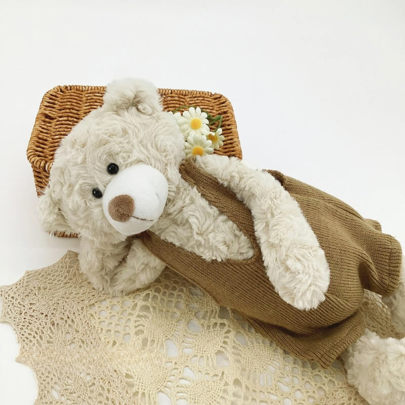 ours en peluche teddy calme couché